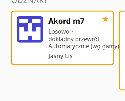 Jedna ukończona karta ćwiczenia z bliska: pomarańczowa ramka i gwiazdka w rogu.